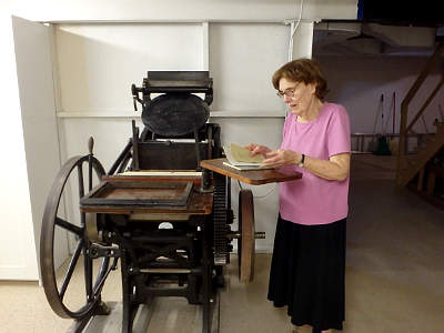 10 x 15 C&P
                  Printing Press with owner Beatrice Hale and some of
                  her husband's work