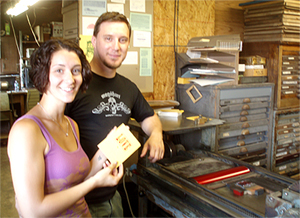 JosephRose & Rosina printing "ALL YOU NEED IS LOVE" on the Vandercook