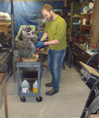 Chris Seiz, working on the Vandercook
                restoration