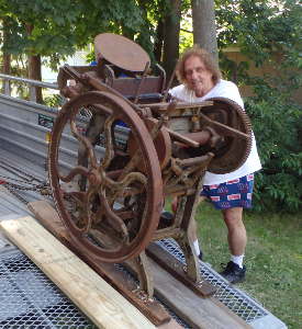 George with "Old Rusty" on the
                  trailer