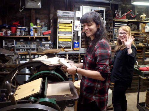 Melissa (on press) and Brittany visit the
                  Excelsior Press